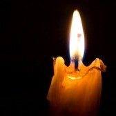2024353-church-candle-on-a-black-background